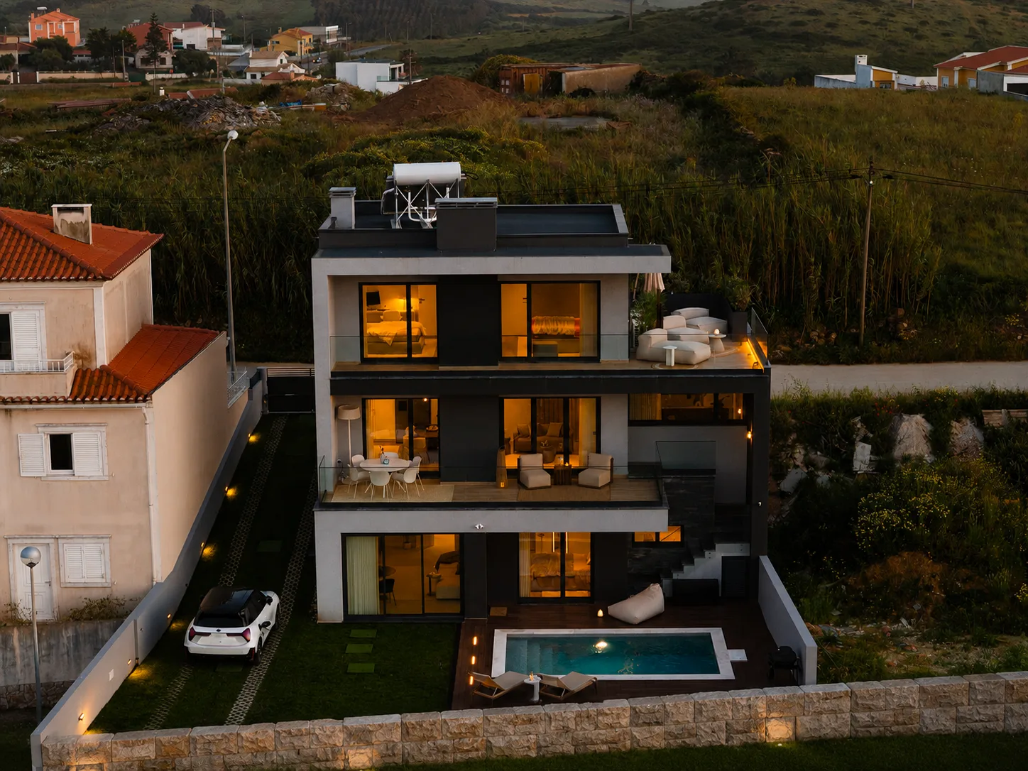 Contemporary villa exterior at dusk